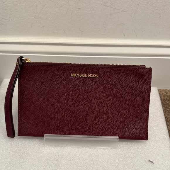 Michael Kors Handbags - Michael Kors Pebbled Leather burgundy wine Wristlet Clutch